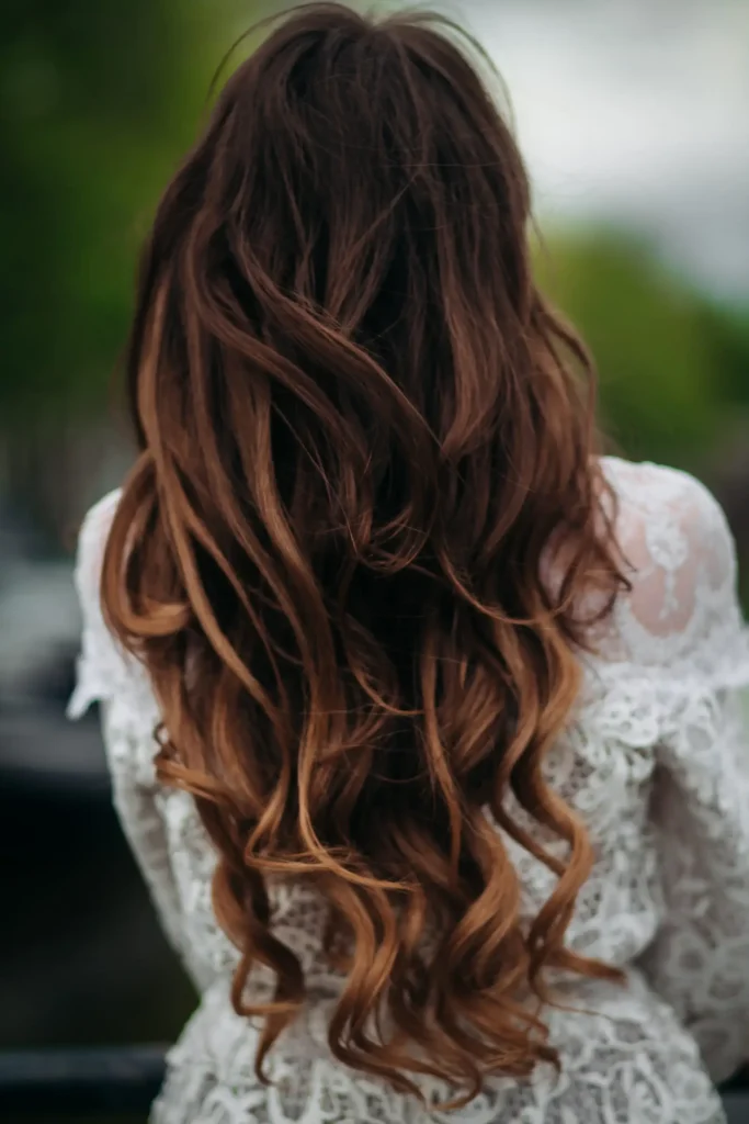 Woman with curly balayage hair